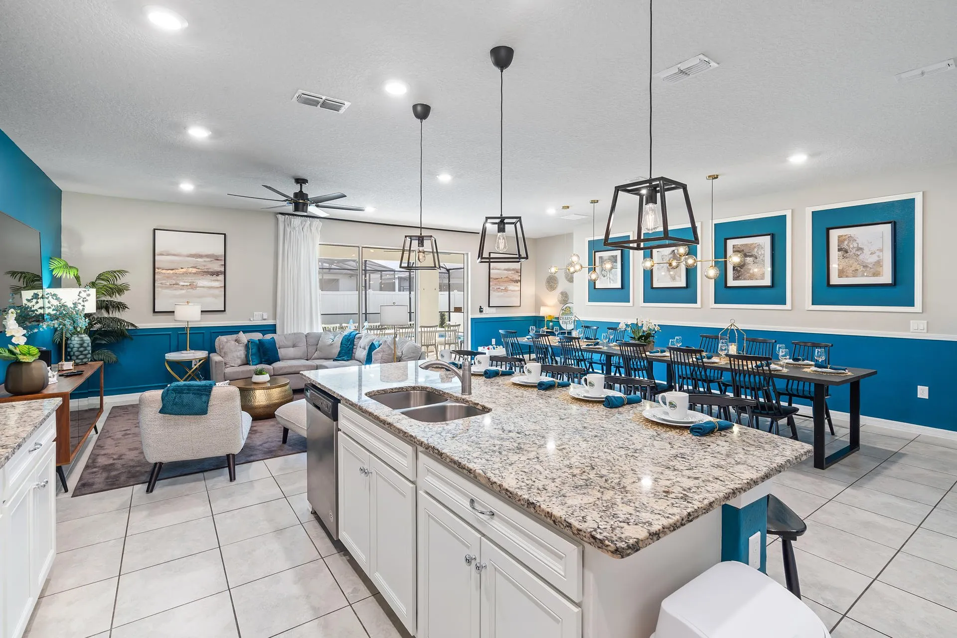 The image depicts an elegant dining area featuring a large table, ideal for group meals and celebrations, surrounded by stylish decor that enhances the luxurious atmosphere. This space is perfect for families and friends to gather and create lasting memories during their vacation at an Orlando villa, complete with all the amenities for a comfortable stay.