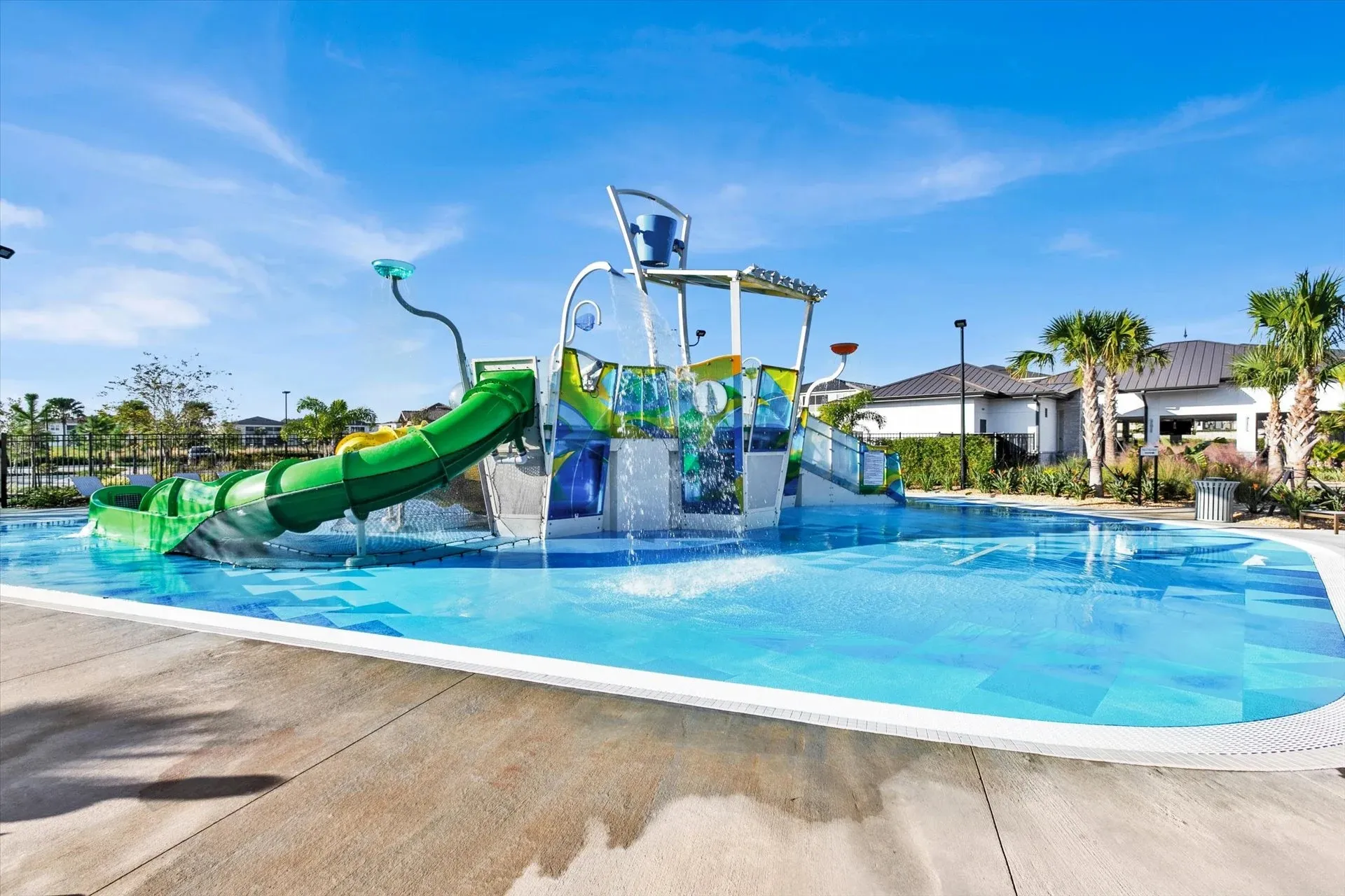 The image depicts a vibrant resort community water park featuring a lazy river, splash areas, and fun attractions for the entire family. Guests can enjoy all the amenities, including private pools and outdoor dining, making it a perfect spot for lasting memories during their vacation in Orlando.