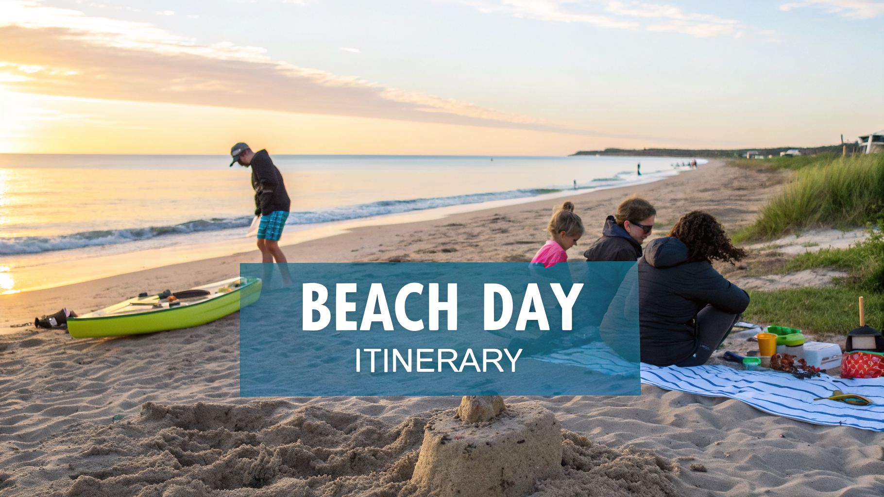 People enjoying a serene beach day at sunrise or sunset with a kayak and sandcastle.